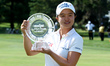 Sei Young Kim of Seoul holds up the trophy after winning the tournament by playoff during...
