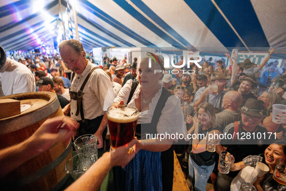 People attend Oktoberfest celebrations in New Glarus, Wisconsin, USA, on September 27, 2025, in the village known as ''America's Little Swit...