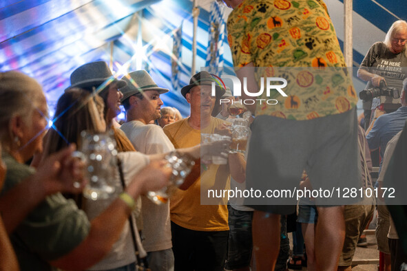 People attend Oktoberfest celebrations in New Glarus, Wisconsin, USA, on September 27, 2025, in the village known as ''America's Little Swit...