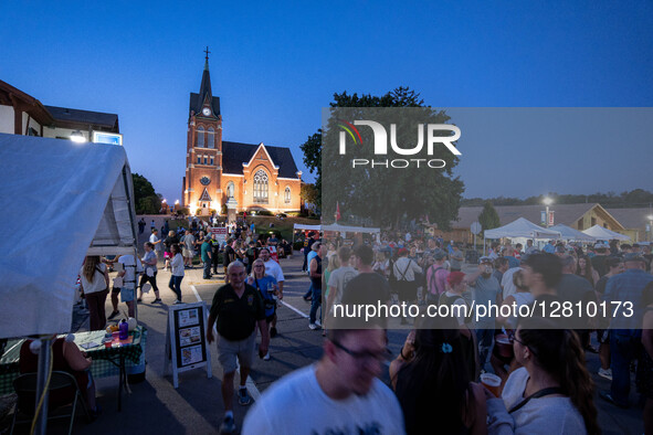 People attend Oktoberfest celebrations in New Glarus, Wisconsin, USA, on September 27, 2025, in the village known as ''America's Little Swit... by Ross Harried/NurPhoto