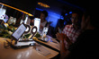 A staff introduces a new smartphone P9 of Huawei during a launching ceremony in Yangon, My...