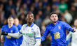 Jamal Lowe of Sheffield Wednesday and Patrick Roberts of Birmingham City chase a high ball...