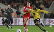 Hayden Hackney of Middlesbrough challenges for the ball with Eric Bocat of Stoke City duri...