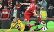 Alan Browne of Middlesbrough is under pressure from Tatsuki Seko of Stoke City during the...