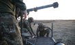 Soldiers of the 39th Separate Coastal Defense Brigade carry out a combat mission with the...
