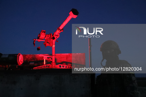 A fighter from the 39th Separate Coastal Defense Brigade poses by the French Mistral short-range air defense system in the Kherson region, U...