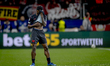 Bayer 04 Leverkusen forward Ernest Poku plays during the match between Bayer 04 Leverkusen...