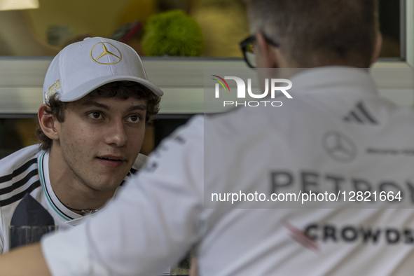 Kimi Antonelli of Italy and Mercedes AMG Petronas F1 Team driver talks with Peter Bonnington, known as Bono, during the media day for the Fo...
