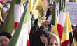 A veiled Iranian mourner shouts anti-Israeli slogans while participating in a ceremony com...