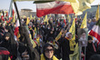 An Iranian woman shouts anti-Israeli and anti-U.S. slogans while participating in a ceremo...