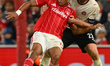Mads Bech Sorensen of FC Midtjylland battles with Dan Ndoye of Nottingham Forest during th...