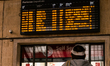 A woman looks at the departures board at Santa Maria Novella train station in Florence, It...