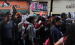 People take part in a demonstration to commemorate the 57th anniversary of the massacre of...