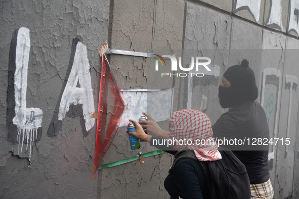 People create graffiti during a protest commemorating the 57th anniversary of the 1968 Student Massacre at the Plaza de las Tres Culturas in... by Eyepix/NurPhoto