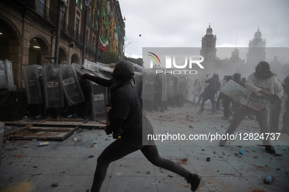 An anarchist throws a stone at riot police during a protest commemorating the 57th anniversary of the 1968 Student Massacre at the Plaza de... by Eyepix/NurPhoto