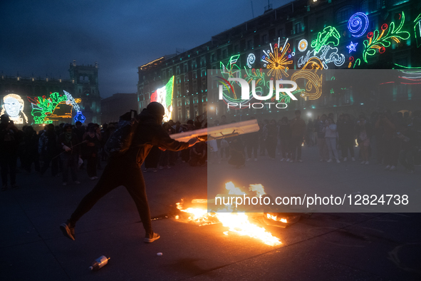 An anarchist sets fire during a protest commemorating the 57th anniversary of the 1968 Student Massacre at the Plaza de las Tres Culturas in...