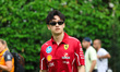 Scuderia Ferrari reserve driver Zhou Guanyu (CHN) walks in the paddock during the 2025 For...