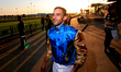 Jockey Faleh Bughenaim leaves the track after a win in the Grade I $750,000 Canadian Inter...