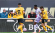 Danny Welbeck of Brighton and Santiago Bueno of Wolverhampton Wanderers are in action duri...