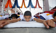 Children from Patanjali Yogpeeth Ashram, a trust run by Indian yog guru Ramdev performing...