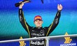 Oracle Red Bull Racing driver #1 Max Verstappen (NED) raises the second-place trophy on th...