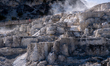 Visitors explore Mammoth Hot Springs at Yellowstone National Park in Yellowstone National...