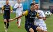 Defender Yevhen Pavliuk of FC Metalist 1925 Kharkiv and midfielder Mykola Mykhailenko of F...