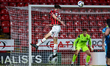 Stan Straw of Walsall flicks the ball towards the corner during the Vertu Trophy match bet...