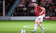 Jamie Ellis of Walsall passes the ball during the Vertu Trophy match between Walsall and N...