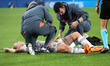 Carolin Simon is injured during the match between FC Barcelona Women and FC Bayern Munich...