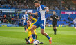 Connor Mahoney of Barrow tackles Jamie Robson of Oldham Athletic during the Sky Bet League...
