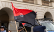 A demonstration 'Stop Illegal Migration, No To Mercosur'er waves an Antifa flag. 