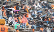 The Princeton Tigers fans take shelter from the rain during a game at Princeton Stadium. d...