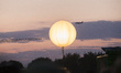 An airplane is pictured at the sundown during the 'Fete de la Musique' music feast at Maue...