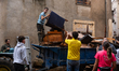 Residents of the town of Godall clean houses and streets after flooding caused by DANA Ali...