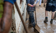Residents of the town of Godall clean houses and streets after flooding caused by DANA Ali...