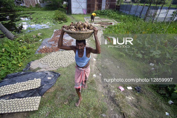 Indian Potters Make Earthen Clay Lamps Ahead Of Diwali Festival