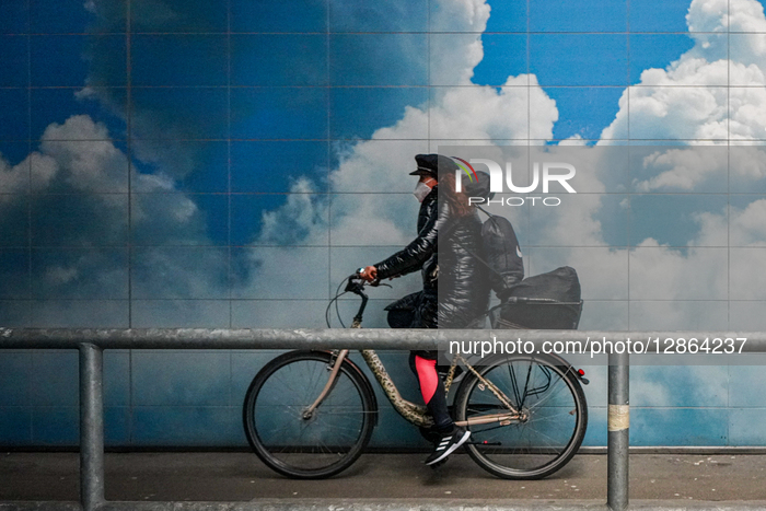 Woman Cycling Through Underpass