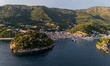 Aerial sunset view of the Venetian Castle of Parga and the town’s old harbor in Parga, Gre...