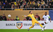 David Alaba of Austria and Vlad Dragomir of Romania are in action during the FIFA World Cu...
