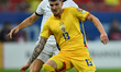 Stefan Posch of Austria and Valentin Mihaila of Romania are in action during the FIFA Worl...