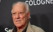 Werner Herzog, a Cologne Film Prize winner, poses for pictures on the red carpet before th...