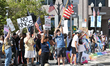 Protesters in Orlando, Florida, on Saturday morning, hold flags and chant the slogan ''No...