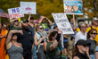 Demonstrators participate in the nationwide 'No Kings' protest against Donald Trump, his p...