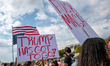 Demonstrators participate in the nationwide 'No Kings' protest against Donald Trump, his p...