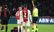 Referee Jeroen Manschot shows a yellow card to Davy Klaassen of AFC Ajax during the match...