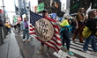 Jonathan from New York City holds up a flag with ''We the People'' on it during the ''No K...