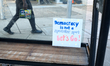 Protest signs remain after people assist a No Kings rally in the Mt Airy neighborhood of P...