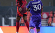 Jules-Anthony Vilsaint #99 of Toronto FC and Alex Freeman #30 of Orlando City SC battle fo...
