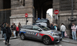French police officers seal off the entrance to the Louvre Museum after a robbery in Paris...